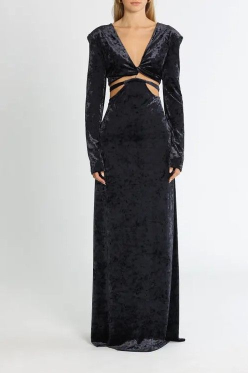 Woman wearing a French Navy velvet maxi dress by CAMILLA AND MARC
