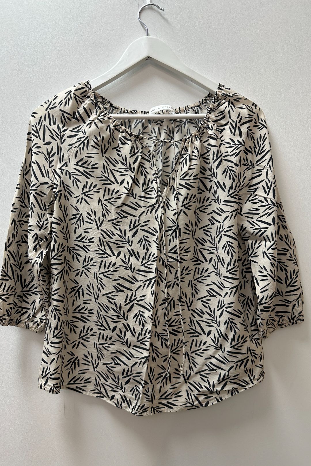 Skin and Threads Cream and Black Printed Tie Front Blouse 