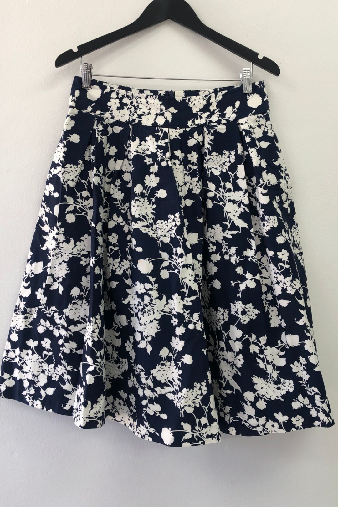 Navy floral store pleated skirt